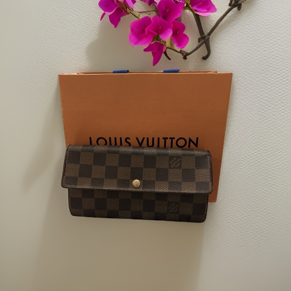 Louis Vuitton monogram wallet.